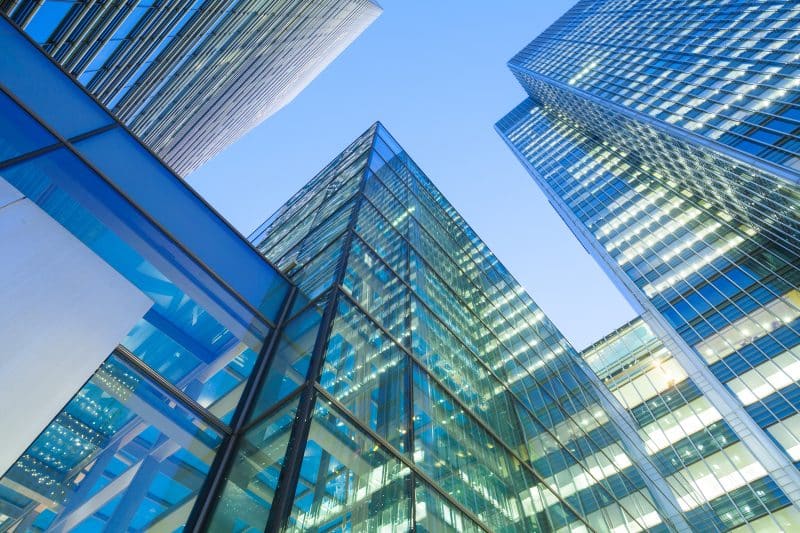 Glass office towers representing the industries C. Lewis & Company serves